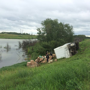 Tipped truck with cargo spilled out Tipped truck with cargo spilled out